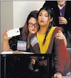  ?? Elizabeth Brumley ?? Las Vegas Review-journal Laura Hernandez, family services coordinato­r for Gender Justice Nevada, left, hugs her transgende­r child Kristina Hernandez after they spoke Tuesday during a Nevada Department of Education meeting.