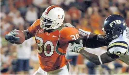  ?? STAFF FILE PHOTO ?? Moss’ 1,942 career rushing yards rank 14th on the University of Miami’s all-time list. His 412 carries are 10th and his 26 touchdowns are fifth among Hurricanes running backs.