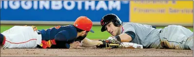  ?? AP/RICHARD CARSON ?? Cleveland catcher Yan Gomes (right) is safe at second base, avoiding the tag of Houston’s Jose Altuve in the second inning of the Indians’ 8-6 victory over the Astros on Sunday at Minute Maid Park in Houston. Gomes added a third-inning home run and...