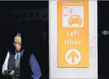  ?? David Goldman Associated Press ?? TWO LAWSUITS contend that Uber and Lyft fall short in making rides available for those in wheelchair­s and that their apps are inadequate. Both companies say they are exploring ways to expand access.