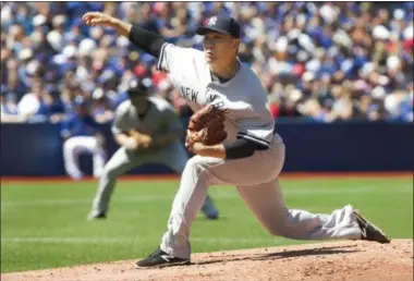  ?? FRED THORNHILL — THE ASSOCIATED PRESS ?? New York Yankees’ starting pitcher Masahiro Tanaka throws against the Toronto Blue jays during the second inning on Saturday.