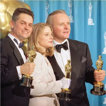  ?? AP) (Photos by Reed Saxon, ?? In this May 31, 1992 file photo, director Jonathan Demme, left, holds his award for best director, actress Jodie Foster holds her award for best actress, and actor Anthony Hopkins holds his award for best actor for their work on “Silence of the Lambs,”...