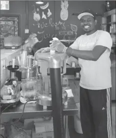  ??  ?? Mouhamadou Taffa in his Concession Street juice bar, The Juice Kitchen.