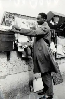  ?? (HARRY RANSOM CENTER, THE UNIVERSITY OF TEXAS AT AUSTIN VIA THE NEW YORK TIMES) ?? Claude Mckay, browsing Parisian book stalls early in the 20th century. His never-published novel, “Romance in Marseille” (left), will be released on February 11.