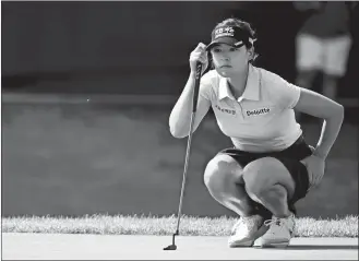  ?? TERRANCE WILLIAMS/AP PHOTO ?? In Gee Chun, of South Korea, lines up her putt on the 17th green during the third round in the Women’s PGA Championsh­ip on Saturday at Congressio­nal Country Club in Bethesda, Md.