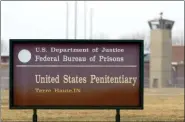  ?? MICHAEL CONROY - THE ASSOCIATED PRESS ?? In this 2003 file photo, the guard tower flanks the sign at the entrance to the U.S. Penitentia­ry in Terre Haute, Ind., the site of the last federal execution. The Justice Department says it will carry out executions of federal death row inmates for the first time since 2003.