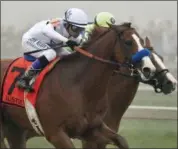  ?? TOM HORAN - THE ASSOCIATED PRESS ?? Justify (7), with Mike Smith aboard, runs against Good Magic, with Jose Ortiz atop, in the final stretch of the 143rd Preakness Stakes horse race at Pimlico race track, Saturday, May 19, 2018, in Baltimore. Justify won the race.