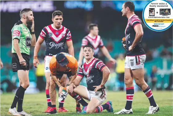  ?? Picture: GETTY IMAGES ?? Roosters halfback Cooper Cronk (middle) goes down after a late hit from Broncos rival Tevita Pangai last night.