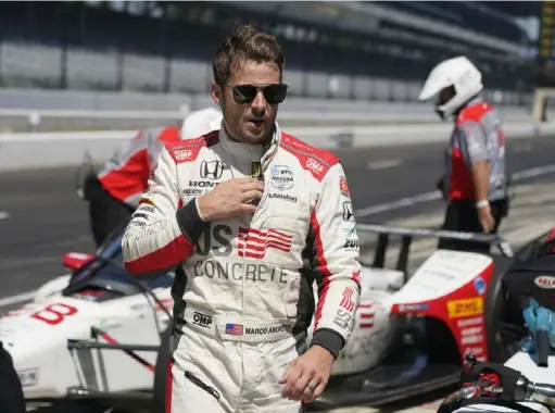  ?? Associated Press ?? Marco Andretti walks in the pits during the final practice session for the Indianapol­is 500 Friday at Indianapol­is Motor Speedway.