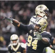  ?? Bill Feig / Associated Press ?? Saints defensive end Cameron Jordan (94) celebrates a defensive stop in Sunday’s game against the Panthers.