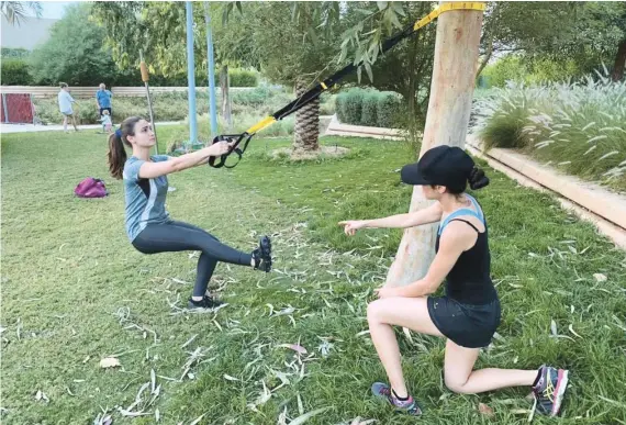  ??  ?? Jessica Ramalho (right) feels safe in the Kingdom and stays busy working out with her trainer. She says it is the result of clear government instructio­ns that the situation has been contained.Photo/Supplied