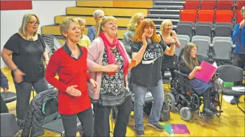  ?? 01_B18choir07 ?? The soprano section belt out a song which has the members dancing and tapping their feet.