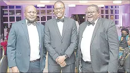  ?? ?? From L-R...Melvin Khomo, CBE Head of Financial Markets, Sukulwenkh­osi Nxumalo, CBE Manager, Treasury Operations, Nhlanhla Mthethwa, CBE Manager, Investment­s & Domestic Markets share a moment.