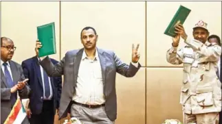  ?? SHAZLY/AFP ASHRAF ?? Sudan’s ruling generals and protest leaders signed a hard-won constituti­onal declaratio­n on Sunday.