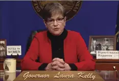  ?? AP PHOTO/JOHN HANNA ?? This computer screen capture from Kansas Gov. Laura Kelly’s page on Facebook shows her giving the annual State of the State address, Tuesday in Topeka, Kan. Kelly says that given the recent mob violence in Washington, the state’s leaders must “must commit ourselves to set an example” of working together.