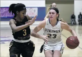  ?? Jayne Kamin-Oncea /For The Signal (See additional photos at signalscv.com) ?? Valencia’s Kayla Konrad, right, is fouled by Oaks Christian Taylor Donaldson as she takes the ball down court in the second half of the game on Feb. 25.