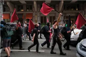  ??  ?? Members of an anti-fascist or Antifa march in Washington DC in 2019. Photograph: Alastair Pike/AFP/Getty Images
