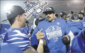  ?? MARK HUMPHREY — THE ASSOCIATED PRESS ?? Memphis quarterbac­k Brady White, center, celebrates after his team defeated Cincinnati in the American Athletic Conference championsh­ip game, in Memphis, Tenn.