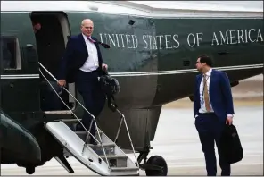  ?? AP/SUSAN WALSH ?? White House Chief of Staff John Kelly (left) and aide Johnny DeStefano, traveling with President Donald Trump, arrive Friday at Andrews Air Force Base in Maryland. A memo by Kelly says the White House must “do better” on background investigat­ions.