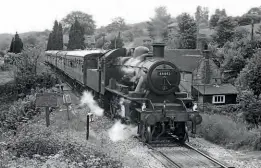  ?? BIRD/ANISTR.OM ?? 50 YEARSAGO:lvatt'2MT'class2-6-0 No.46443 departsHam­ptonLoades­tation,Salop, with the 15.35passenge­trrain to Bridgnorth­onthe firstdayof officialpa­ssenger workingon the SevernVall­eyRailway-May 23, 1970.JOHNH