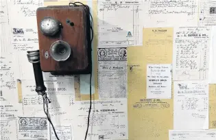  ??  ?? Commercial past . . . A historic telephone and bills and receipts from days gone by.