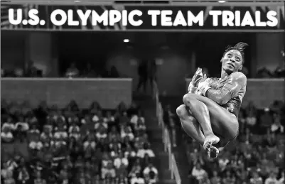  ?? AP FILE ?? Simone Biles competes on the uneven bars during the US Olympic gymnastics trials in San Jose, California on July 8. The 19-year-old will be looking to defend her all-around title when the Games open in Rio de Janeiro on Aug 5.