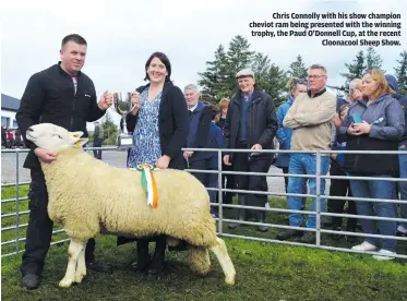  ?? ?? Chris Connolly with his show champion cheviot ram being presented with the winning trophy, the Paud O’Donnell Cup, at the recent Cloonacool Sheep Show.