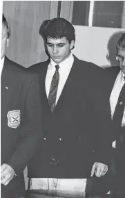  ?? CAPE BRETON POST • FILE ?? Darren Muise being taken into court in 1992 or 1993.