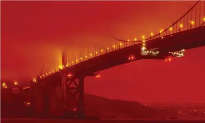  ?? Photograph: Frederic Larson/AP ?? California­ns woke up to red, sunless skies and layers of ash coating everything as a result of wildfires across the state.