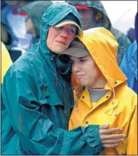  ?? THE ASSOCIATED PRESS ?? Joan Olsen, left, and her daughter, Emily, embrace at the Walk for Suicide Awareness in Wisconsin on Sept. 11, 2010. The government Thursday reported rising suicide rates.