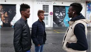  ?? (Regis Duvigna/Reuters) ?? MOKHTAR, A SUDANESE migrant (right), speaks with friends at a refugee center after their arrival from Spain, in Bayonne, France, last week.