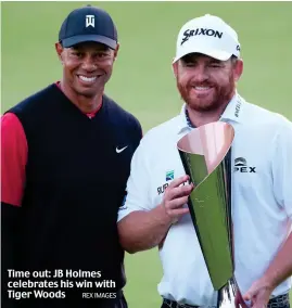  ?? REX IMAGES ?? Time out: JB Holmes celebrates his win with Tiger Woods