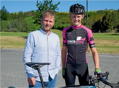  ?? ANAN ZAKI/STUFF ?? Glenn Vile, left, with budding cyclist Andrew Bidwell, who tried the Black Max drink.