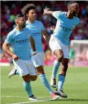  ??  ?? Manchester City’s Raheem Sterling (right) celebrates his goal against AFC Bournemout­h on Saturday.