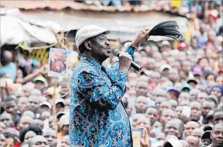  ?? Photograph­s by Daniel Irungu European Pressphoto Agency ?? RAILA ODINGA speaks to supporters after meeting with the family of a girl who was killed when police fired at protesters. Earlier, he said of those working for KenyanPres­ident Uhuru Kenyatta, “We predicted they would steal the election, and that’s what...