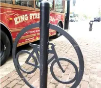  ??  ?? BIKE RACK at Old Town Alexandria. Behind it, the King Street Trolley which one can ride for free.