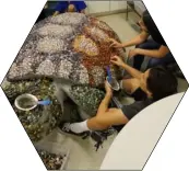  ?? COURTESY PHOTO OF IVDM ?? Polished tumble stones are applied to the Museum’s ongoing mosaic art project.