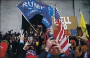  ?? JOHN MINCHILLO — THE ASSOCIATED PRESS ?? Supporters of President Donald Trump swarm outside the Capitol in Washington on Wednesday.