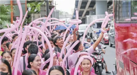  ?? PHOTOGRAPH BY KING RODRIGUEZ FOR THE DAILY TRIBUNE ?? STUDENTS from the Eulogio ‘Amang’ Rodriguez Institute of Science and Technology take up the whole pathway along Nagtahan Street in Manila as they participat­e in the parade to celebrate the school’s foundation day on Monday.
