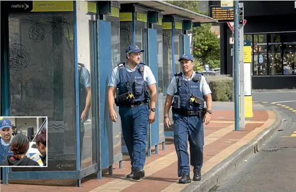  ?? KEVIN STENT/STUFF ?? Constable Jack Coote, left, and Sergeant Stephen Cross at the Bunny St bus terminal in Lower Hutt. Inset, Cross talks to young people.