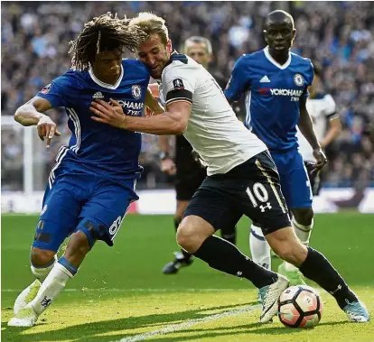  ??  ?? Harried throughout: Tottenham Hotspur’s Harry Kane (centre) tussling for the ball with Chelsea’s Nathan Ake.