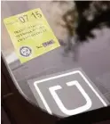  ?? Gary Coronado / Houston Chronicle ?? Riders can now make appointmen­ts for pickup by Uber drivers, a move that will make the ride service more competitiv­e with taxis in Houston.