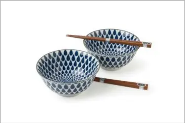  ?? MIYA VIA AP ?? Indigo blue raindrops create a pleasing geometric pattern on this bowl that can be used for rice, cereal or soup.