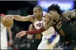  ?? TONY DEJAK — THE ASSOCIATED PRESS ?? The 76ers’ Al Horford, left, and Kevin Porter Jr. battle for a loose ball in the first half Feb. 26.