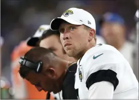  ?? GAIL BURTON — THE ASSOCIATED PRESS ?? Jacksonvil­le Jaguars quarterbac­k Nick Foles sits on the bench against the Baltimore Ravens during the first half of an NFL football preseason game, Thursday.