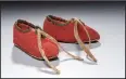  ?? Courtesy of the Museum of the American Revolution ?? This pair of red baby booties on display at the Museum of the American Revolution was made from the coat of a British foot soldier. They belonged to Massachuse­tts native Sgt. James Davenport, who lost two brothers in the war.