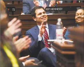  ?? Brian A. Pounds / Hearst Connecticu­t Media ?? DECD Commission­er David Lehman applauds during Gov. Ned Lamont’s budget address to the General Assembly at the Capitol in Hartford on Feb. 20.