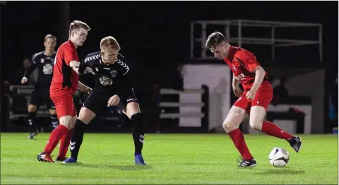  ??  ?? Darren Furlong looks to make ground for Arklow Town against Liffey Wanderers.