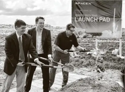  ?? David Pike / Associated Press file ?? U.S. Rep. Filemon Vela, left, breaks ground in 2014 with SpaceX founder Elon Musk and Gov. Rick Perry for the launch pad at Boca Chica Beach in South Texas. Musk recently moved to Texas from California.