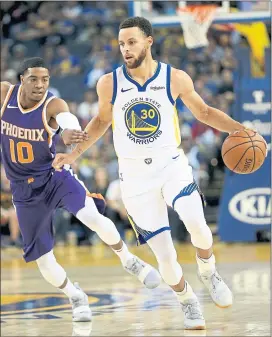  ?? JANE TYSKA — STAFF PHOTOGRAPH­ER ?? Stephen Curry dribbles down court past the Suns’ Shaquille Harrison. Curry scored 23 points in 24 minutes in the Warriors’ 117-109 preseason loss on Monday night.